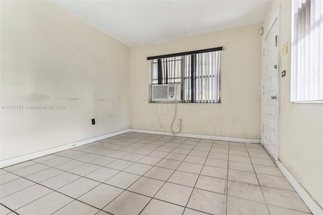 spare room with light tile patterned floors