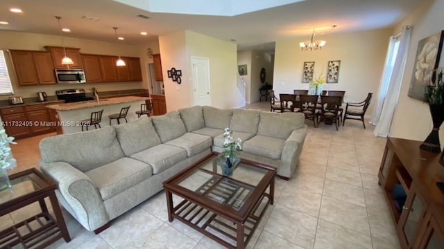 living room with light tile patterned floors and a chandelier