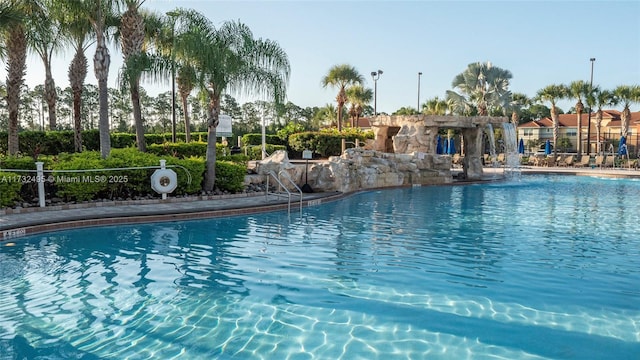 view of swimming pool featuring pool water feature