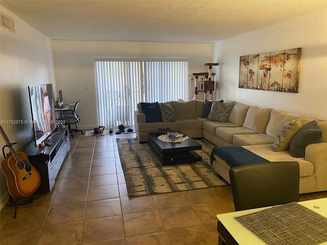 tiled living room with a textured ceiling