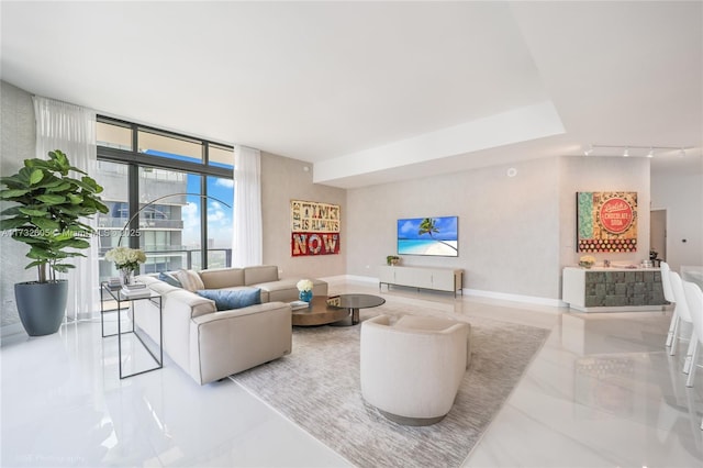 living room featuring expansive windows and track lighting