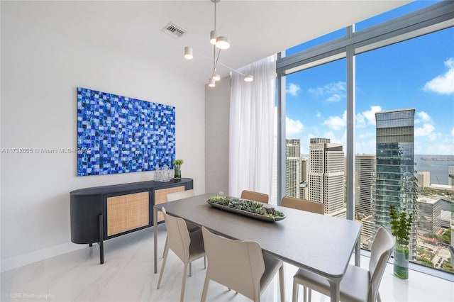 dining space featuring expansive windows