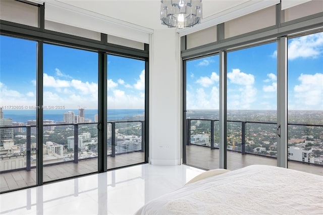 unfurnished bedroom featuring tile patterned flooring, expansive windows, and a water view