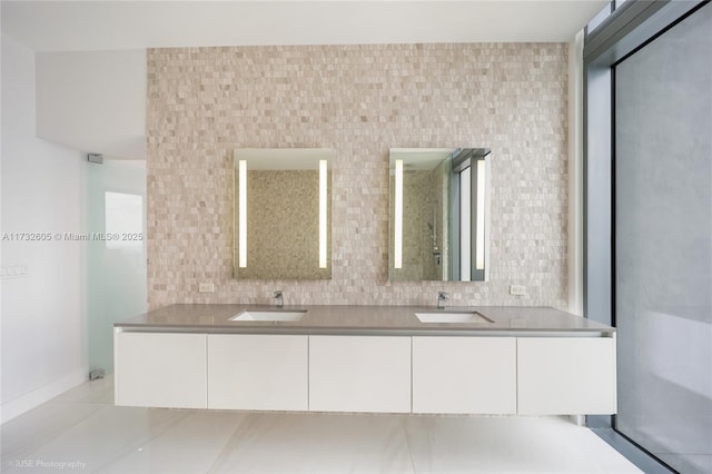 bathroom with vanity, tile patterned floors, and decorative backsplash