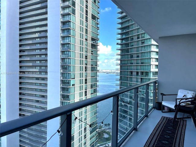 balcony featuring a water view