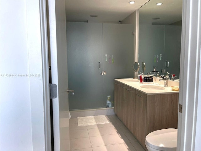 bathroom with tile patterned floors, toilet, and vanity