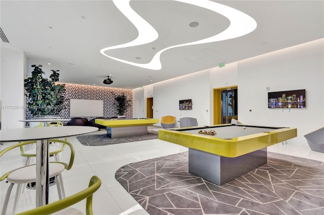 recreation room with billiards and dark tile patterned flooring