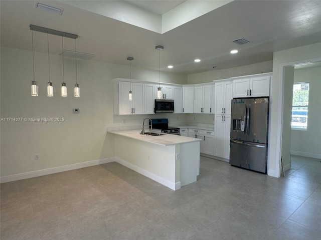 kitchen with sink, appliances with stainless steel finishes, white cabinetry, decorative light fixtures, and kitchen peninsula