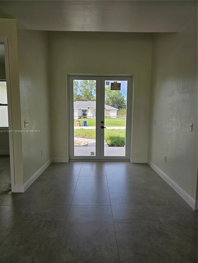 unfurnished room with french doors