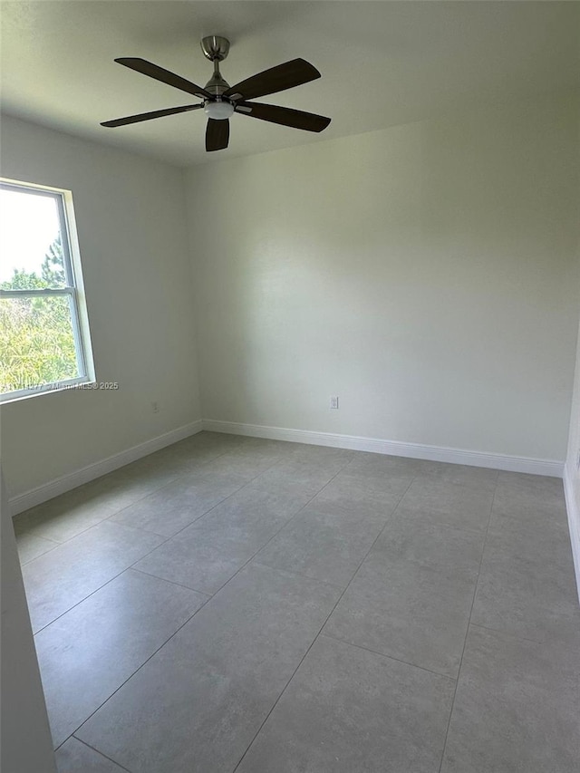 spare room featuring ceiling fan