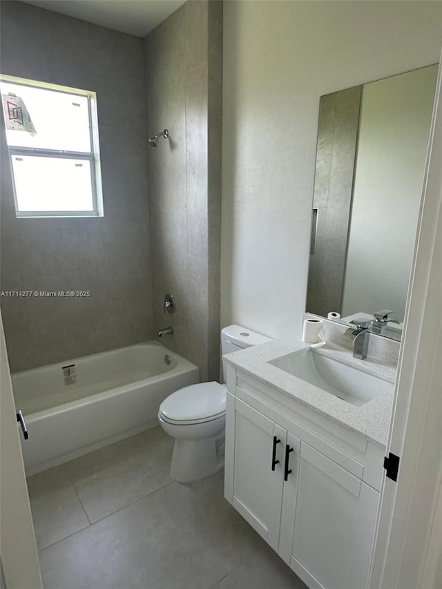 full bathroom with vanity, shower / tub combination, tile patterned floors, and toilet