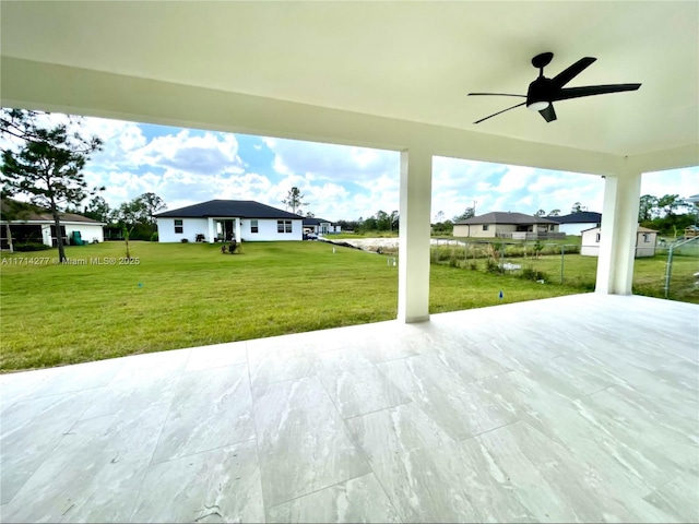 view of patio featuring ceiling fan