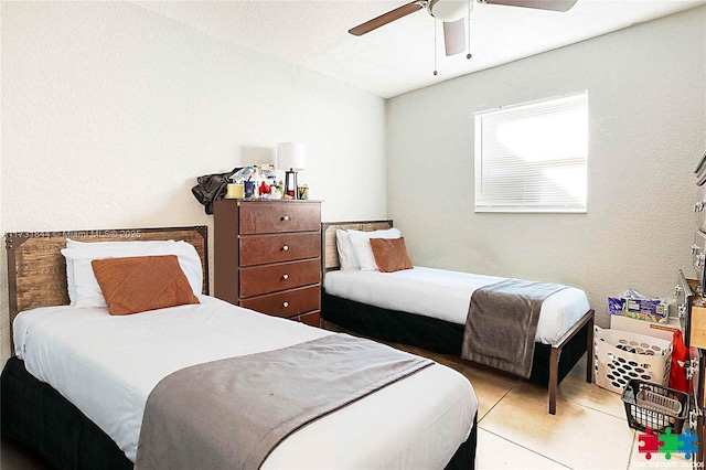 bedroom featuring light tile patterned floors and ceiling fan