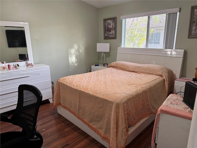 bedroom featuring dark wood-type flooring