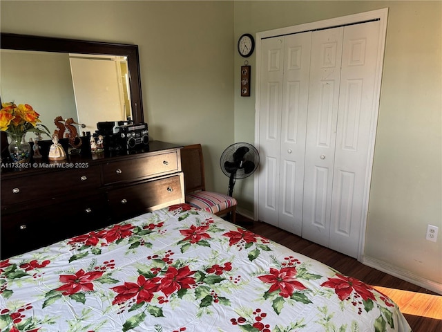 bedroom featuring dark hardwood / wood-style flooring and a closet