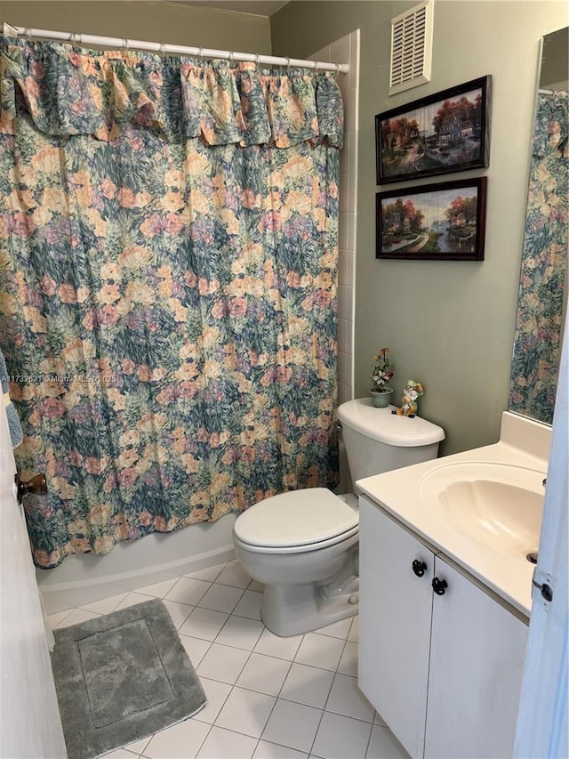 full bathroom featuring tile patterned flooring, vanity, toilet, and shower / bathtub combination with curtain