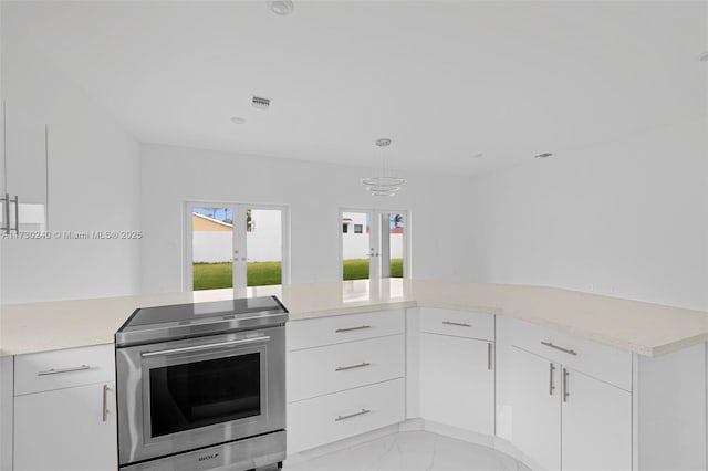 kitchen with french doors, white cabinetry, decorative light fixtures, and stainless steel range with electric stovetop