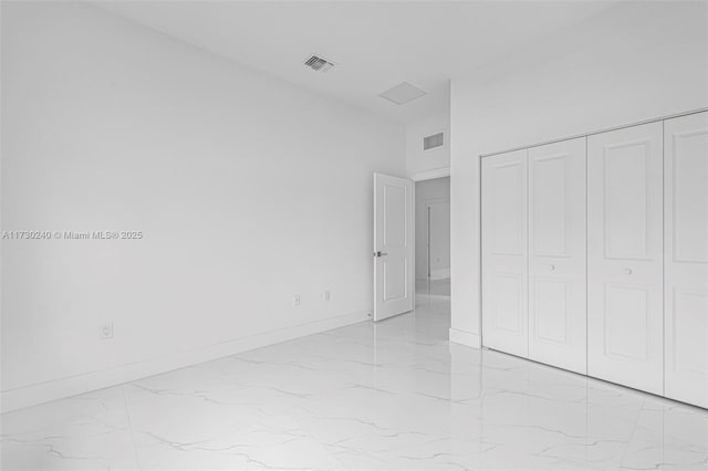 unfurnished bedroom with a closet