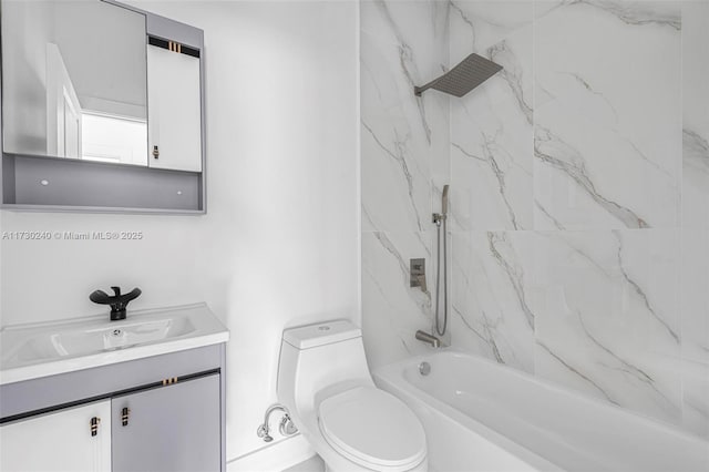 full bathroom with vanity, toilet, and tiled shower / bath combo