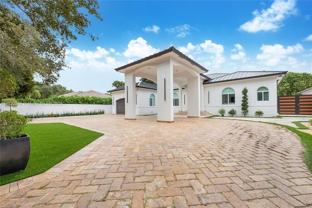 back of house with a garage