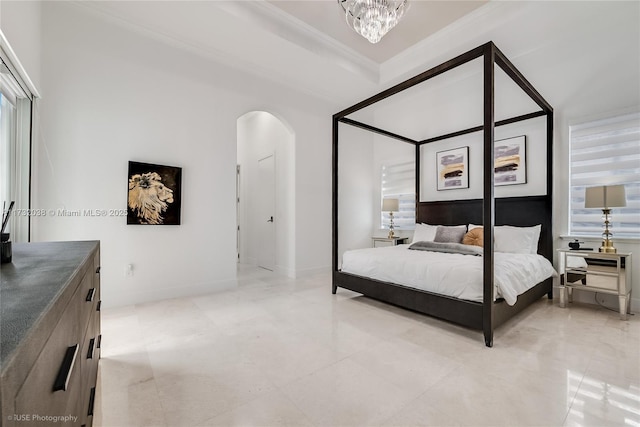 bedroom with crown molding and a chandelier