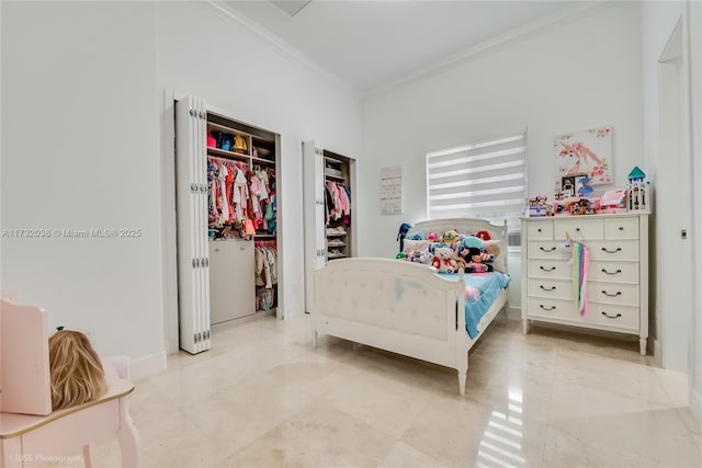 bedroom with crown molding and a closet