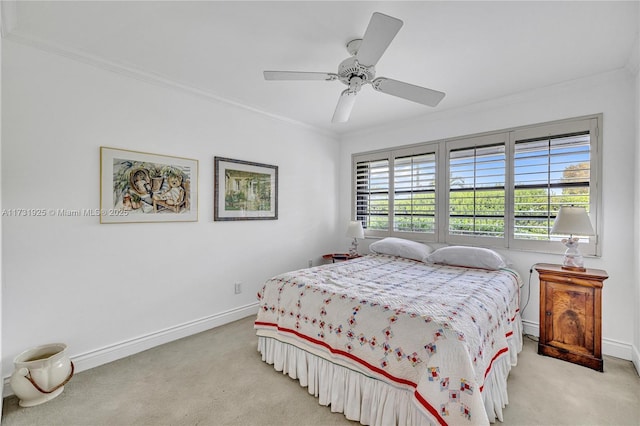 bedroom featuring ceiling fan, light colored carpet, and ornamental molding