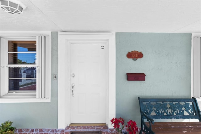 doorway to property featuring visible vents