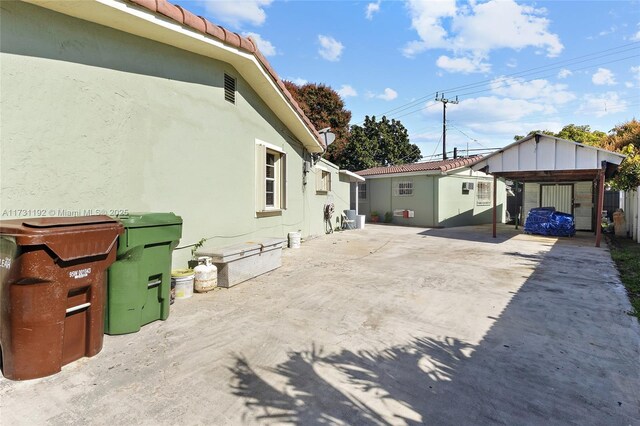 view of property exterior featuring a gazebo and a patio area