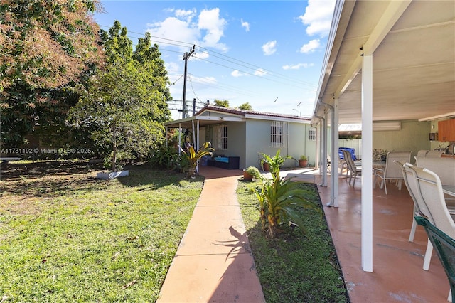 view of yard with a patio and fence