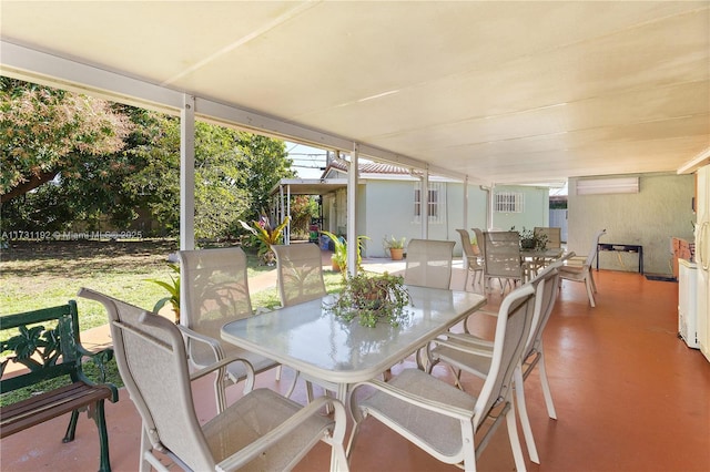 sunroom with a wall mounted AC