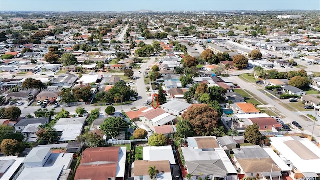 birds eye view of property with a residential view