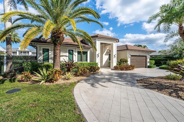 mediterranean / spanish home featuring a garage