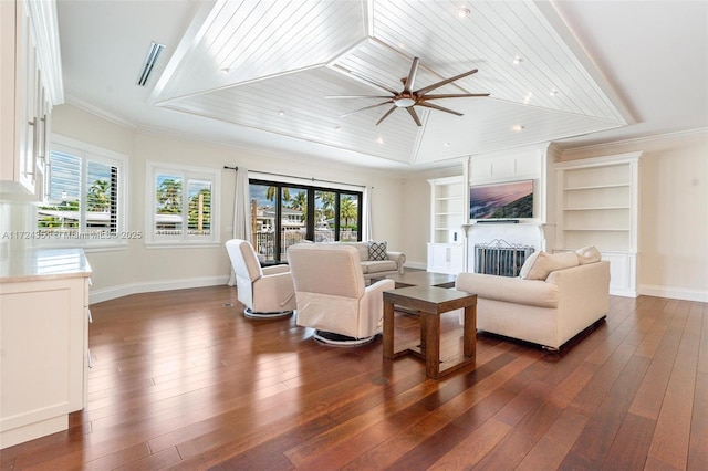 living room with crown molding, wood ceiling, dark wood-type flooring, and a wealth of natural light