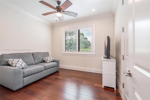 living room with crown molding, dark hardwood / wood-style floors, and ceiling fan