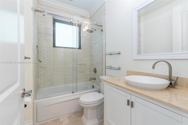 full bathroom featuring enclosed tub / shower combo, tile patterned flooring, vanity, ornamental molding, and toilet