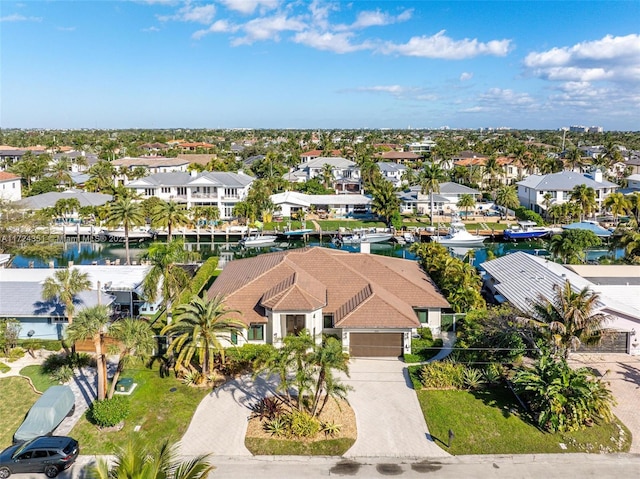 birds eye view of property featuring a water view