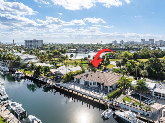 birds eye view of property with a water view