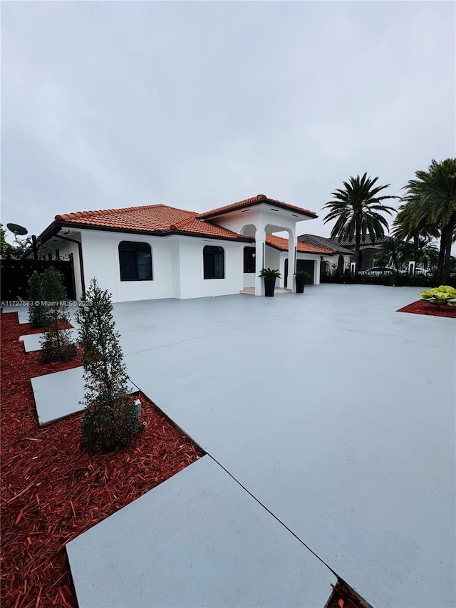 mediterranean / spanish house featuring a garage