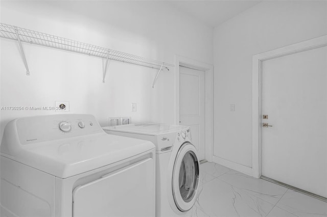 laundry area featuring washing machine and dryer