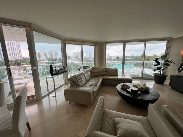 living room featuring a water view and expansive windows