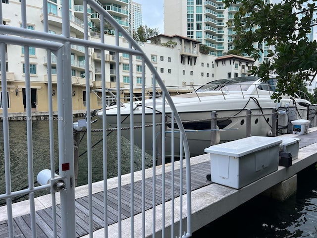 balcony featuring a boat dock and a water view