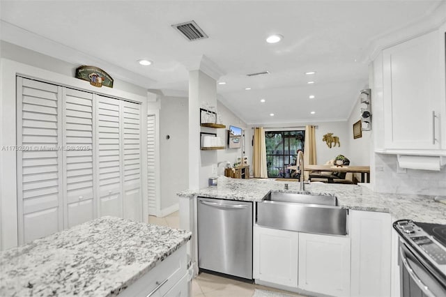 kitchen featuring sink, ornamental molding, appliances with stainless steel finishes, light stone countertops, and white cabinets