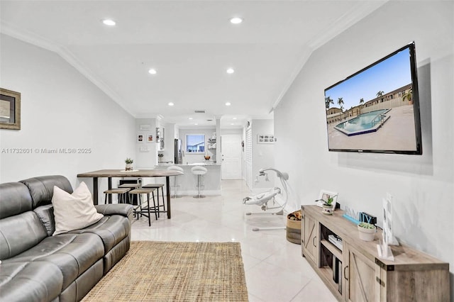 tiled living room with vaulted ceiling and ornamental molding