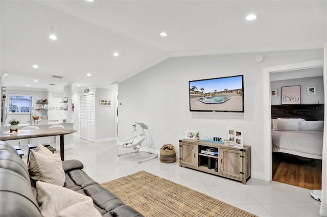 living room featuring vaulted ceiling and light tile patterned floors