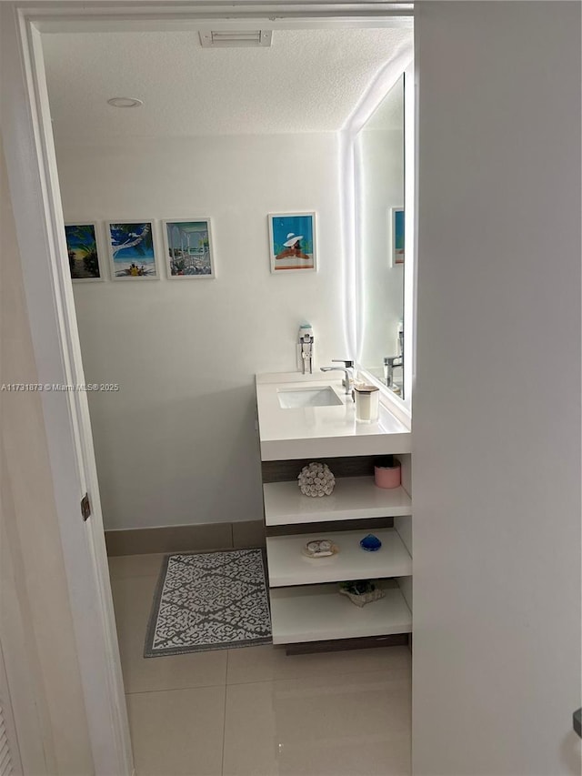 bathroom with vanity and tile patterned flooring