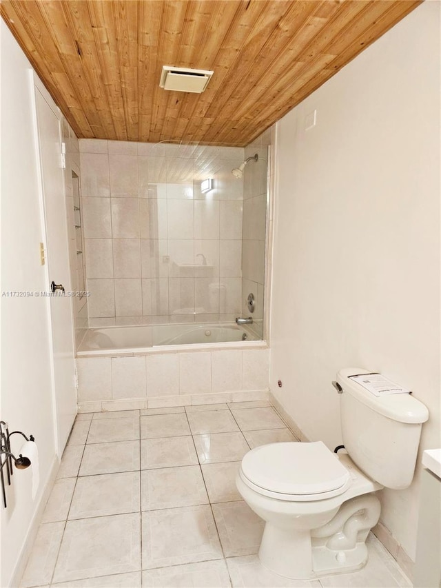 bathroom with tiled shower / bath combo, tile patterned flooring, wood ceiling, and toilet