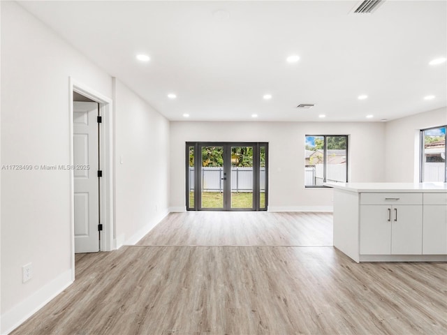 interior space featuring french doors and light hardwood / wood-style floors