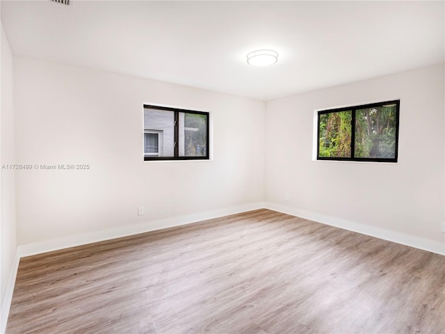 empty room with light wood-type flooring