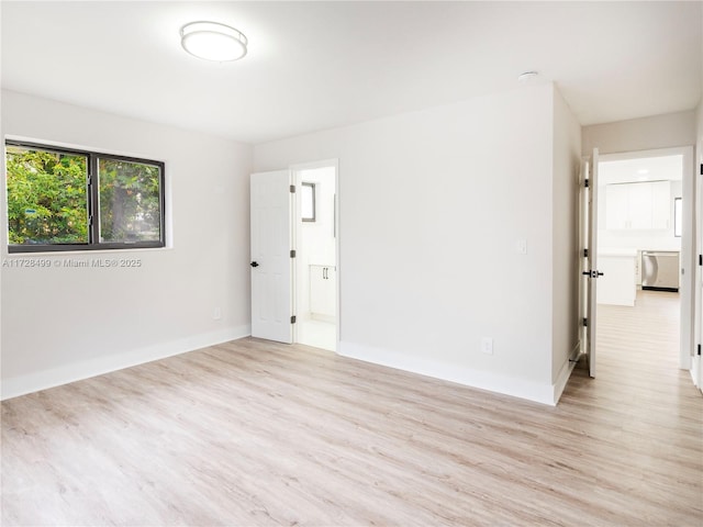 unfurnished room with light hardwood / wood-style floors